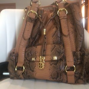 Iman global chic large tote with organizational pockets/matching sunglass pouch.